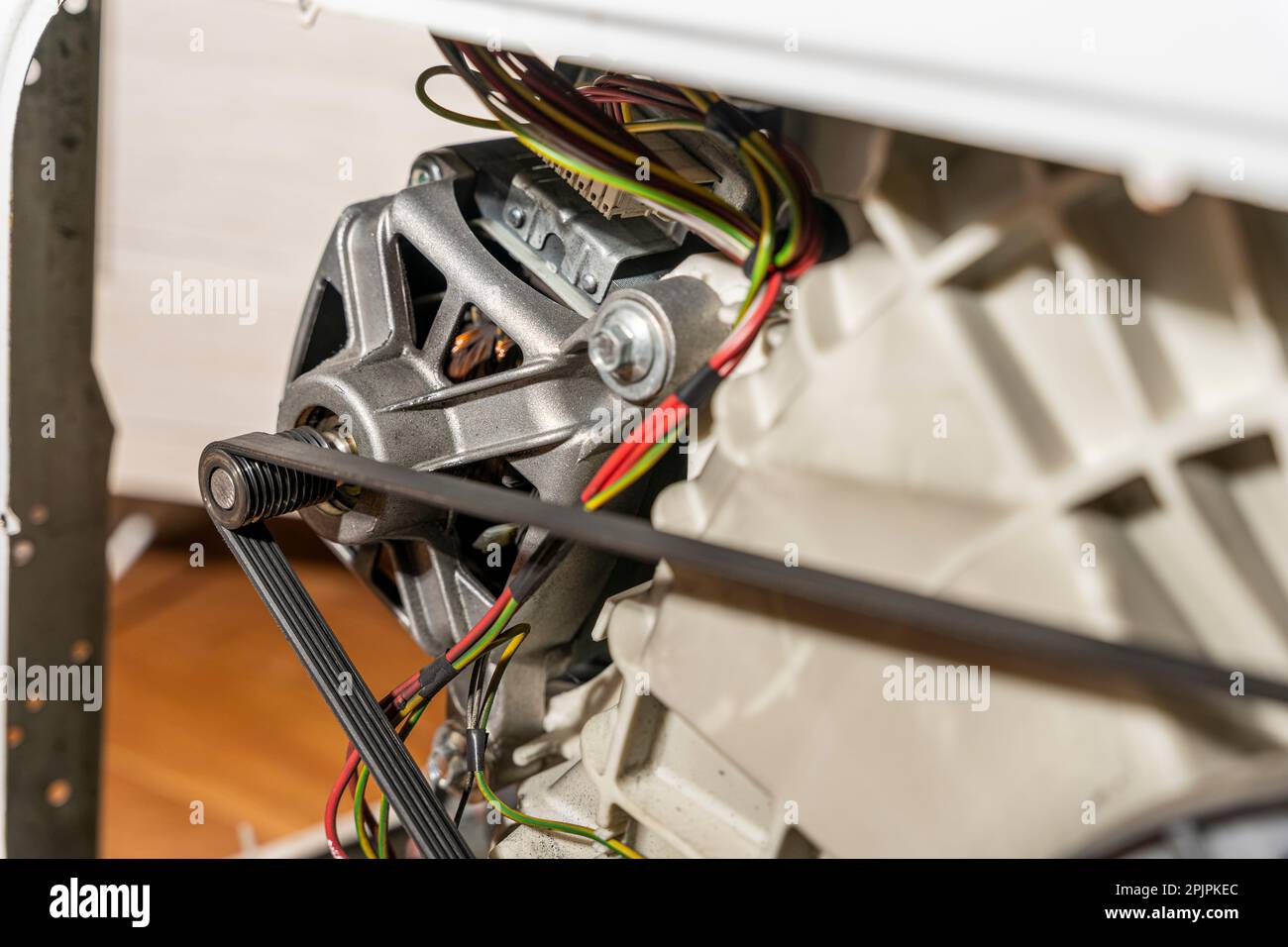 Electric motor and belt drive of an electric washing machine Stock