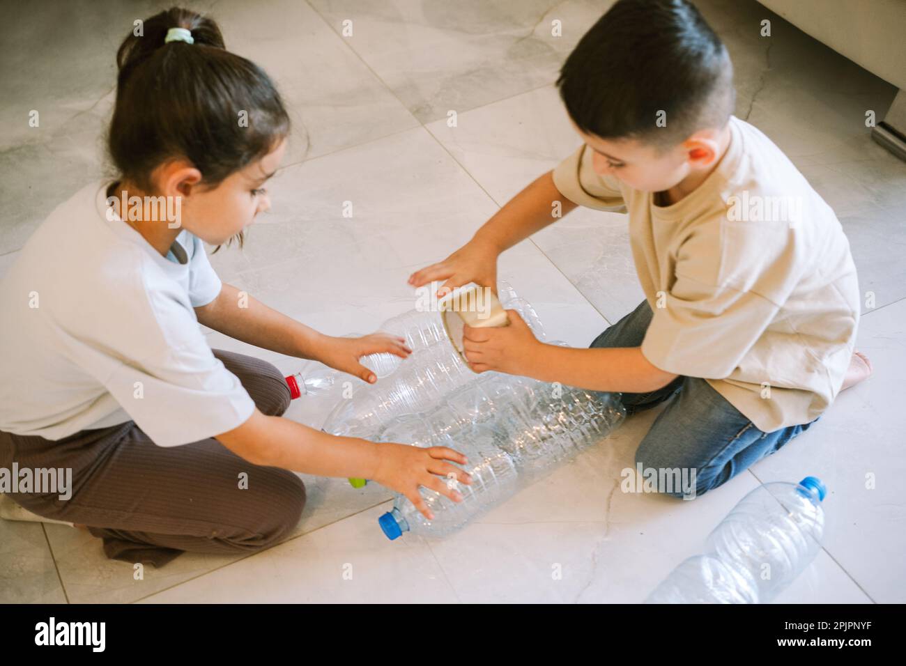 Craft Idea for Kids Recycled Toy Tower From Plastic Bottles, Teaching Environmental