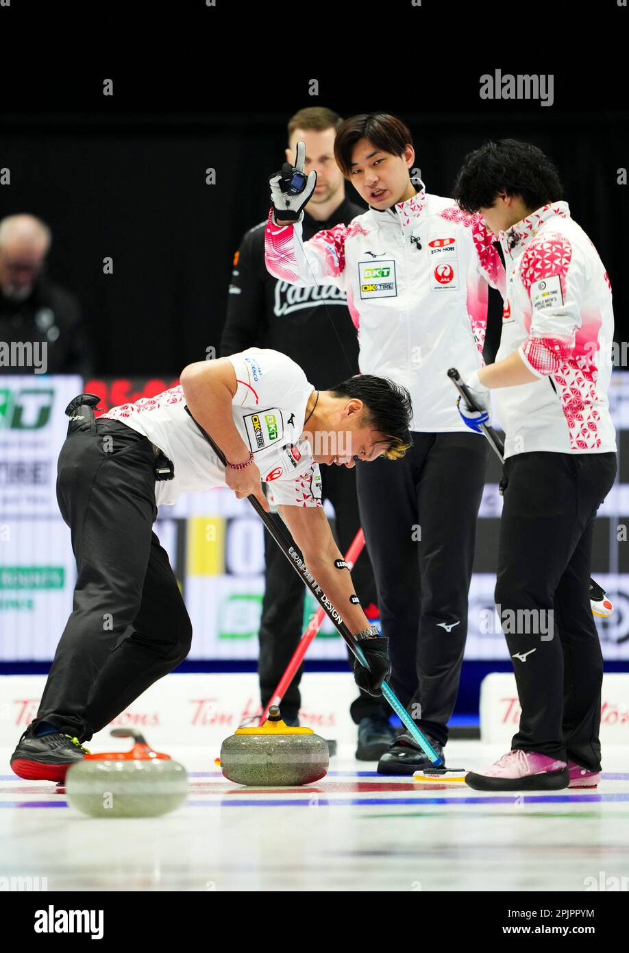 Japan skip Riku Yanagisawa calls sweep as Canadian skip Brad Gushue looks on at the Mens World Curling Championship in Ottawa, Monday, April 3, 2023