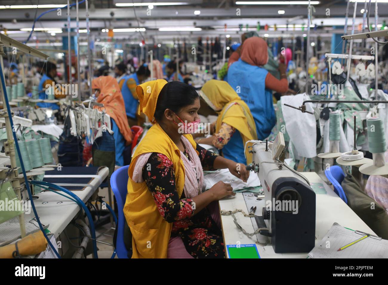 Garment workers work at a readymade garment factory in Bangladesh