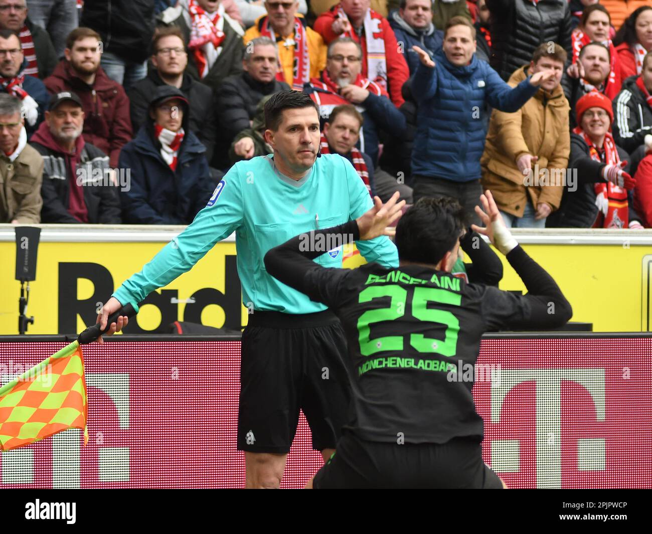 Cologne, North Rhine-Westphalia, Germany. 2nd Apr, 2023. Borussia Monchengladbach defender RAMY BENSEBAINI (25, front) is frustrated by the decision from assistant referee STEFAN LUPP (back) to give a corner to FC Cologne in the FC Cologne-Borussia Monchengladbach Bundesliga match on April 2, 2023 in the RheinEnergieStadion in Cologne, Germany. (Credit Image: © Kai Dambach/ZUMA Press Wire) EDITORIAL USAGE ONLY! Not for Commercial USAGE! Stock Photo