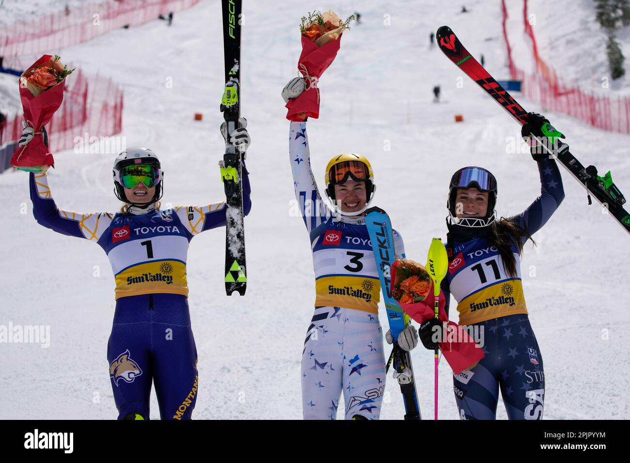 Kristiane Bekkestad (1), Lila Lapanja (3), and Dasha Romanov (11) celebrate  during a rose ceremony after the women's slalom ski race during the U.S.  Alpine Championships, Monday, April 3, 2023, at the