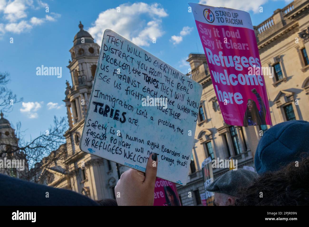 Protesters gather outside Westminster Square in opposition to the Illegal Migration Bill, groups oppose the bill and want refugees to feel welcome. Stock Photo