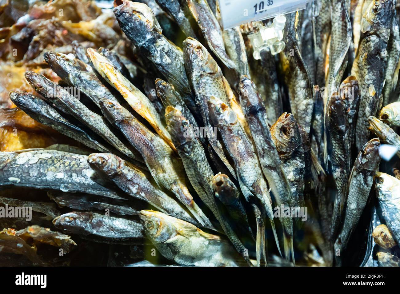 Cured herring and other fish in supermarket Stock Photo Alamy