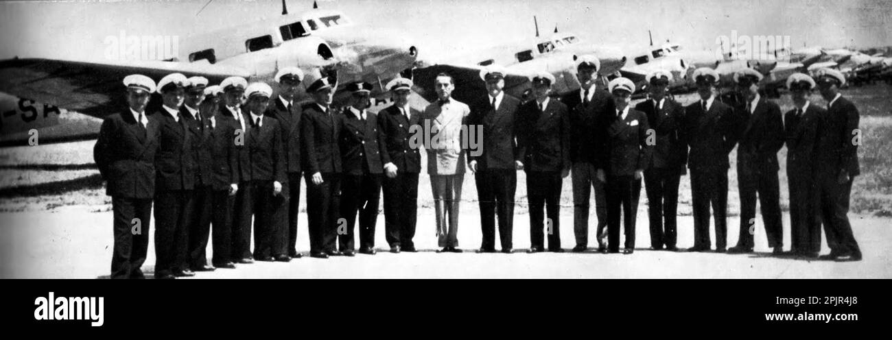 Tadija Sondermajer surrounded by Aeroput's pilots in 1938. The Aeroput fleet in the background is composed of most Lockheed Model 10 Electra and Caudron C.449 Goéland Stock Photo