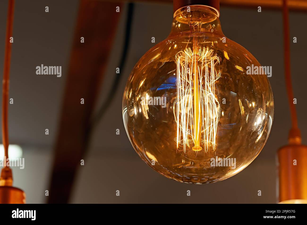 Electric light on bulbs with dark background Stock Photo