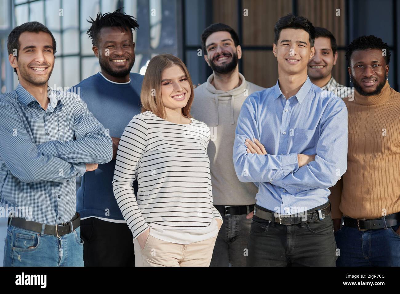 Successful business team smiling while standing in the office Stock ...