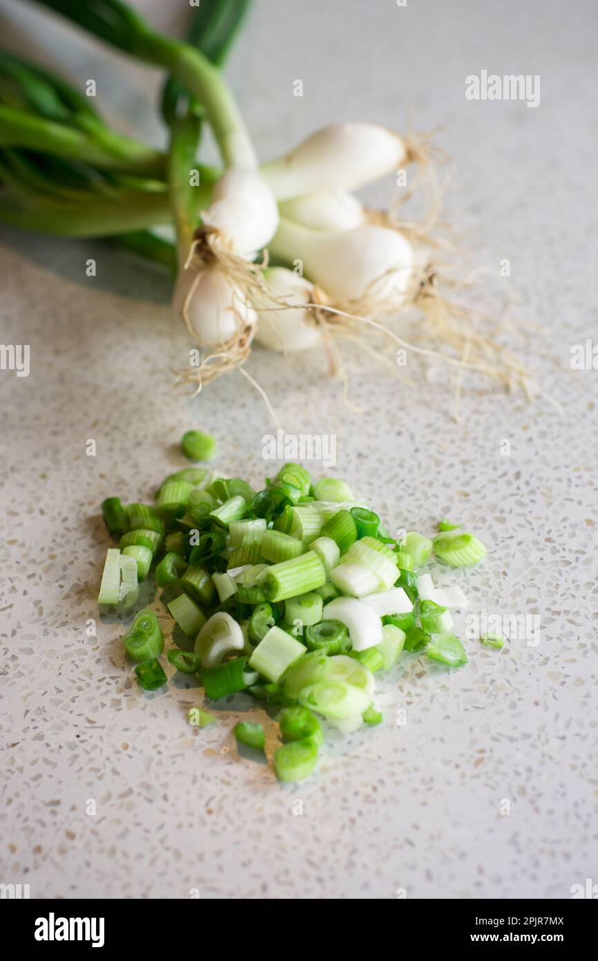 Chopped fresh green onions ready to cook peruvian food Stock Photo - Alamy