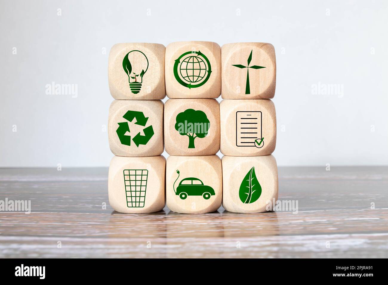 Green and eco building concept. wooden cubes with green building symbols on the natural background. LEED certification. Leadership in Energy and Envir Stock Photo
