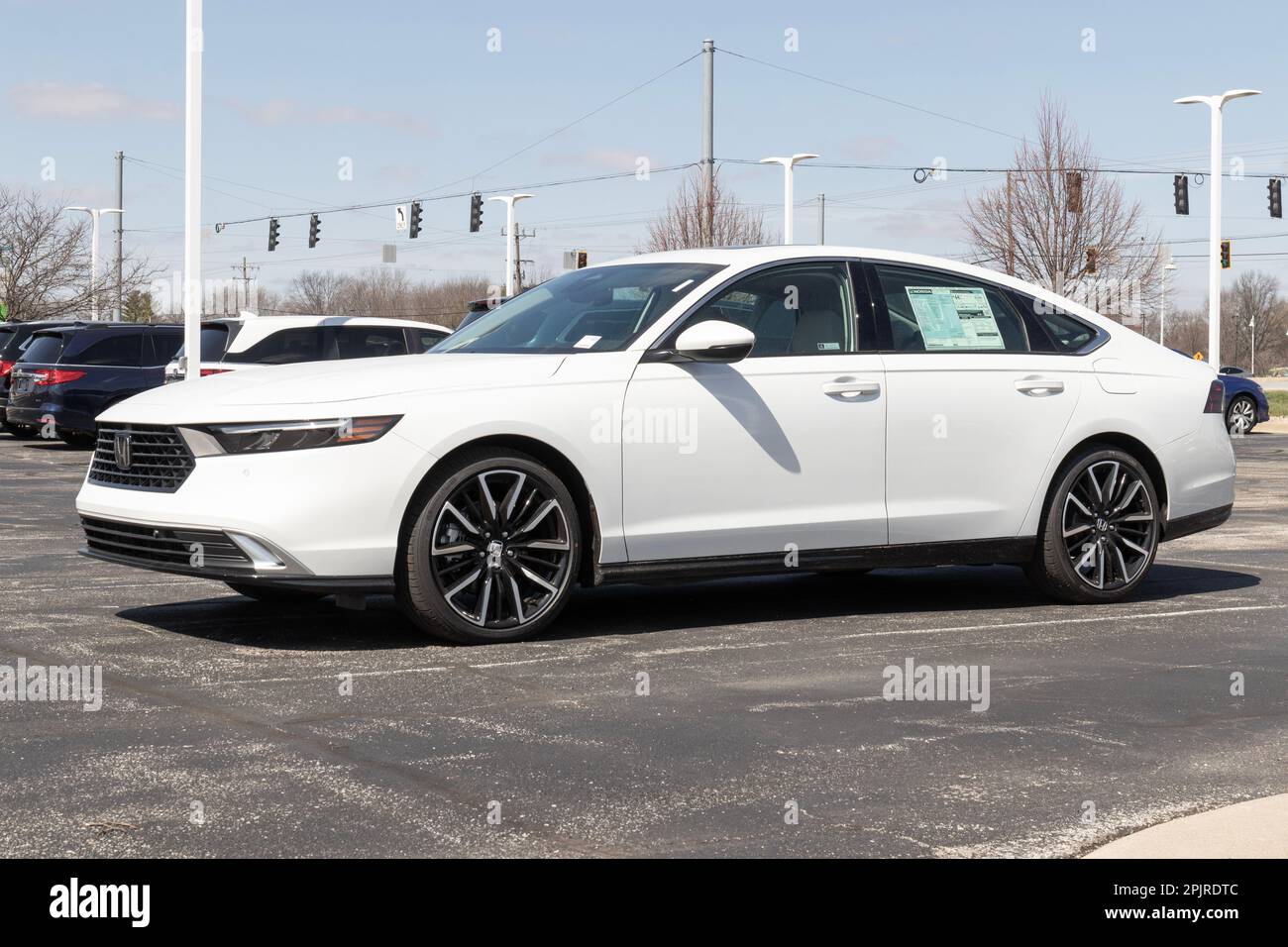 Avon - Circa April 2023: Honda Accord Hybrid display at a dealership. The Honda Accord is one of the top 25 cars sold in the US every year. Stock Photo