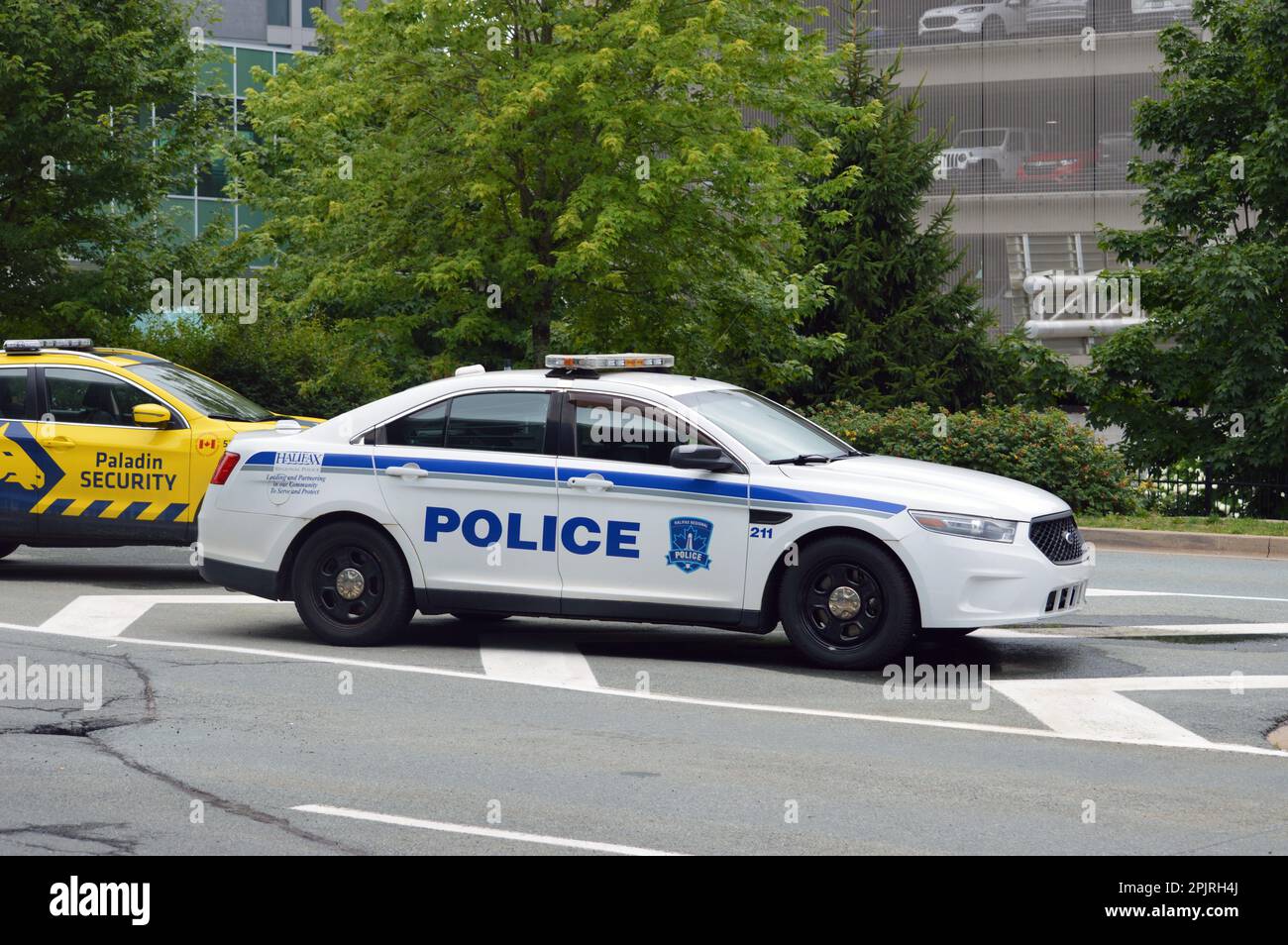 A Halifax Regional Police car, a Ford Police Interceptor, parked outside the Halifax Stanfield International Airport terminal in Nova Scotia, Canada Stock Photo