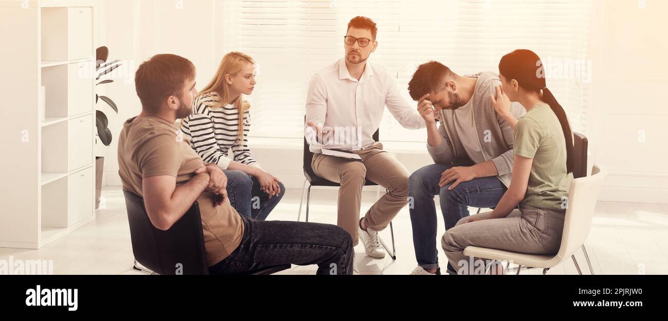 Psychotherapist working with group of drug addicted people at therapy ...