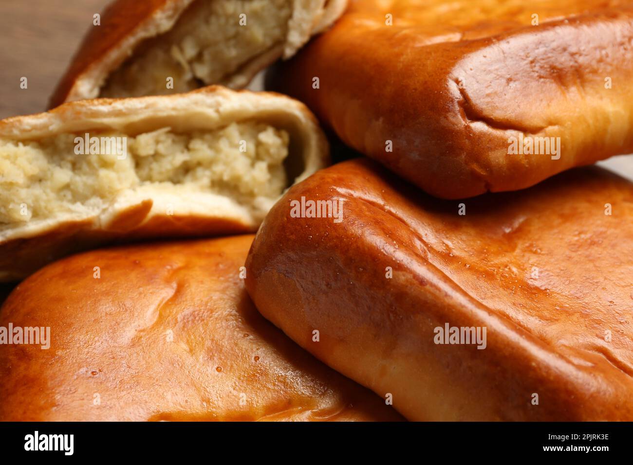 Heap of delicious baked patties with potato, closeup Stock Photo