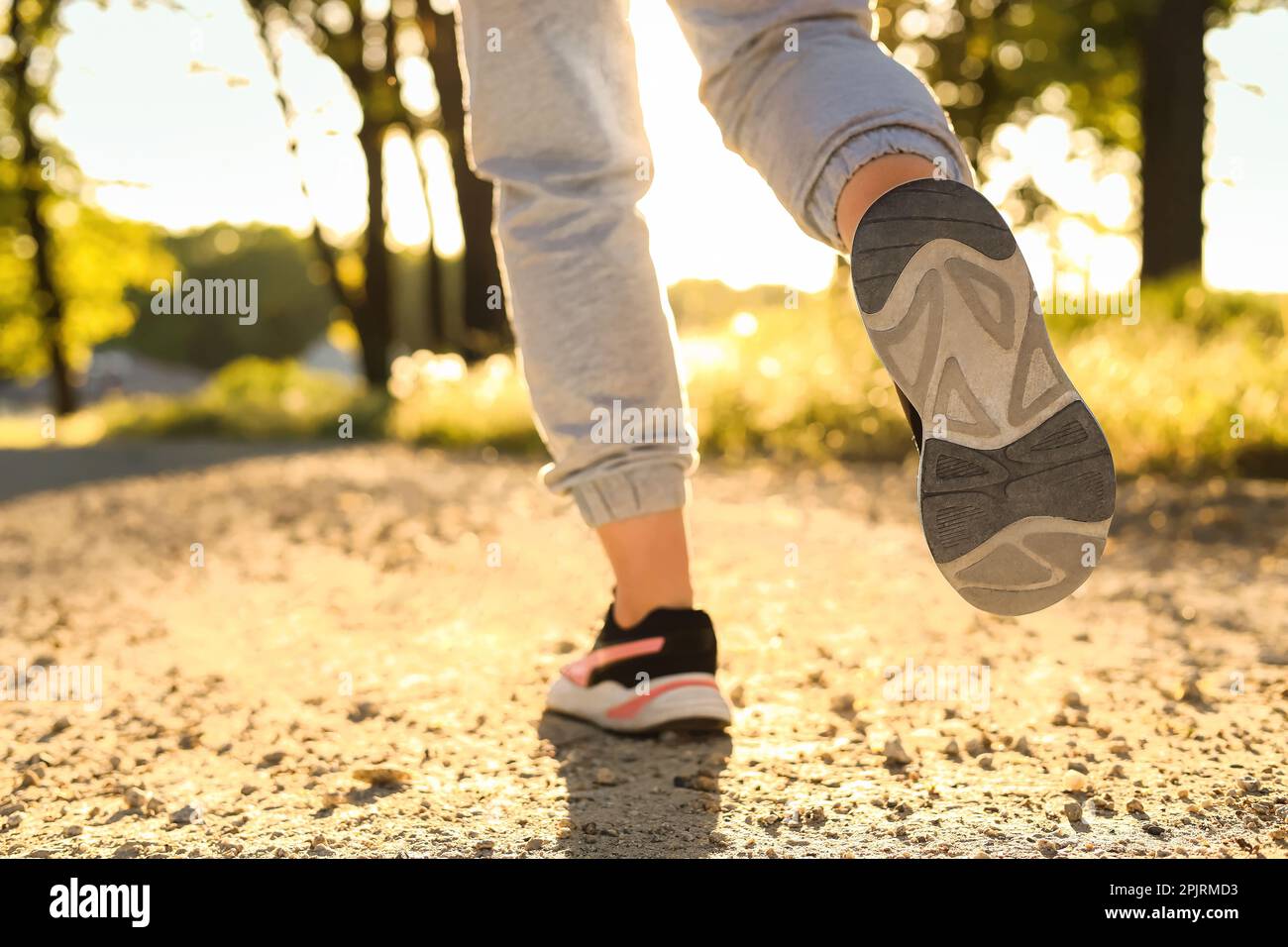 Woman jogging on pathway hi-res stock photography and images - Alamy