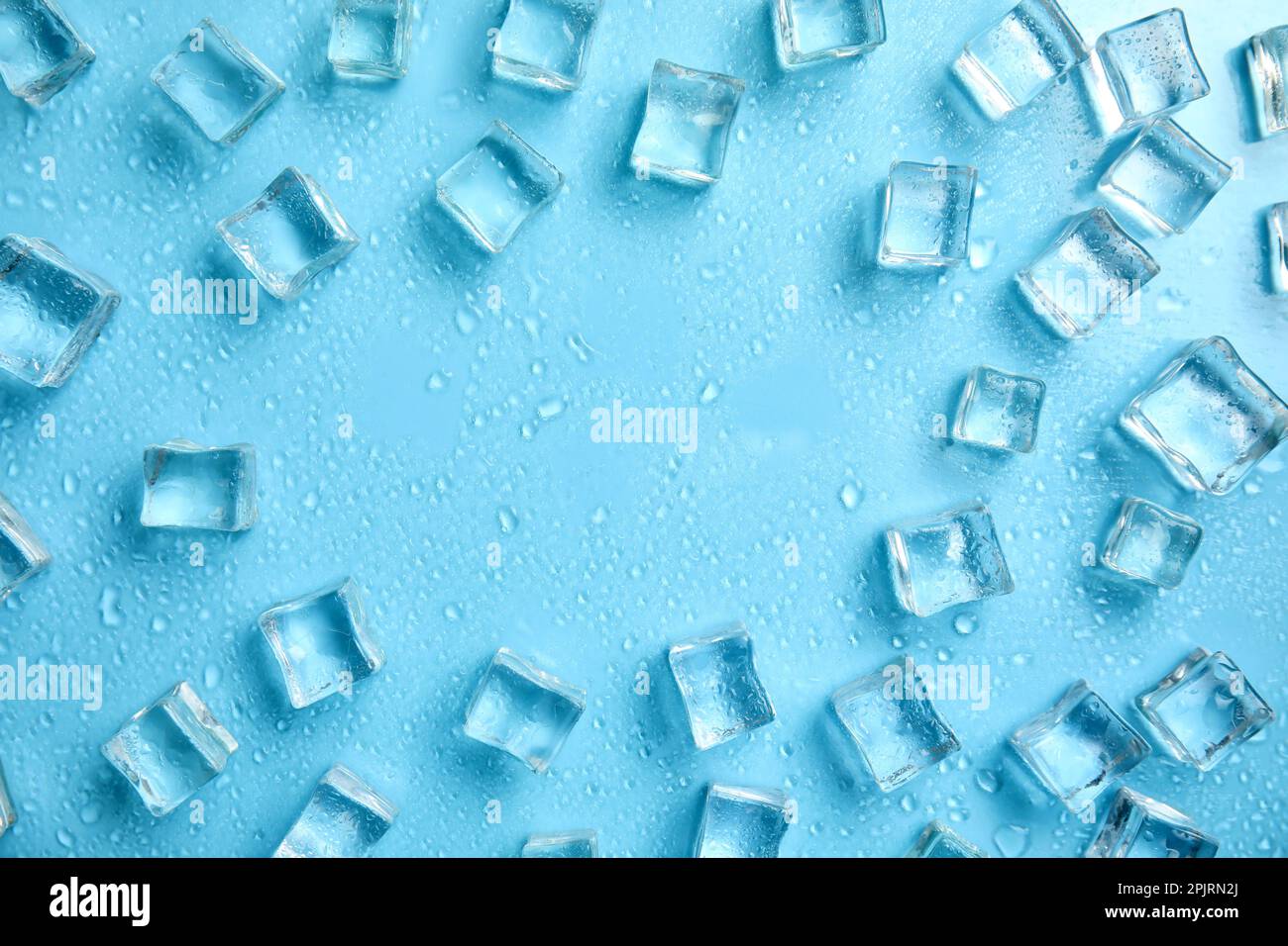 Frame made of ice cubes with space for text on turquoise background ...