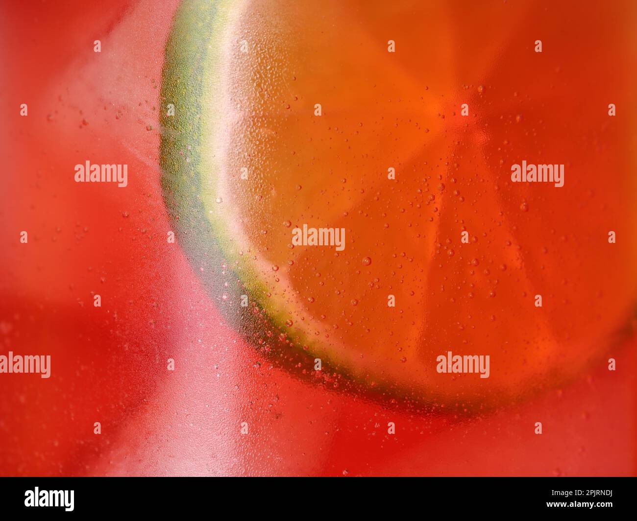 Glass of refreshing drink with ice cubes and lime slice as background ...