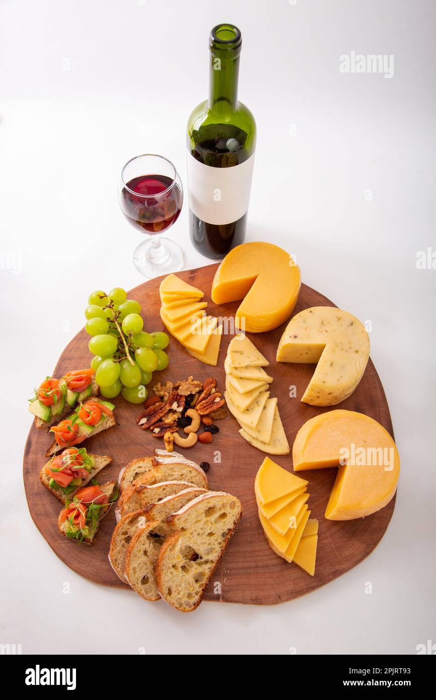 Cheese and wine table with bread grapes and bruschetta antipasti ...
