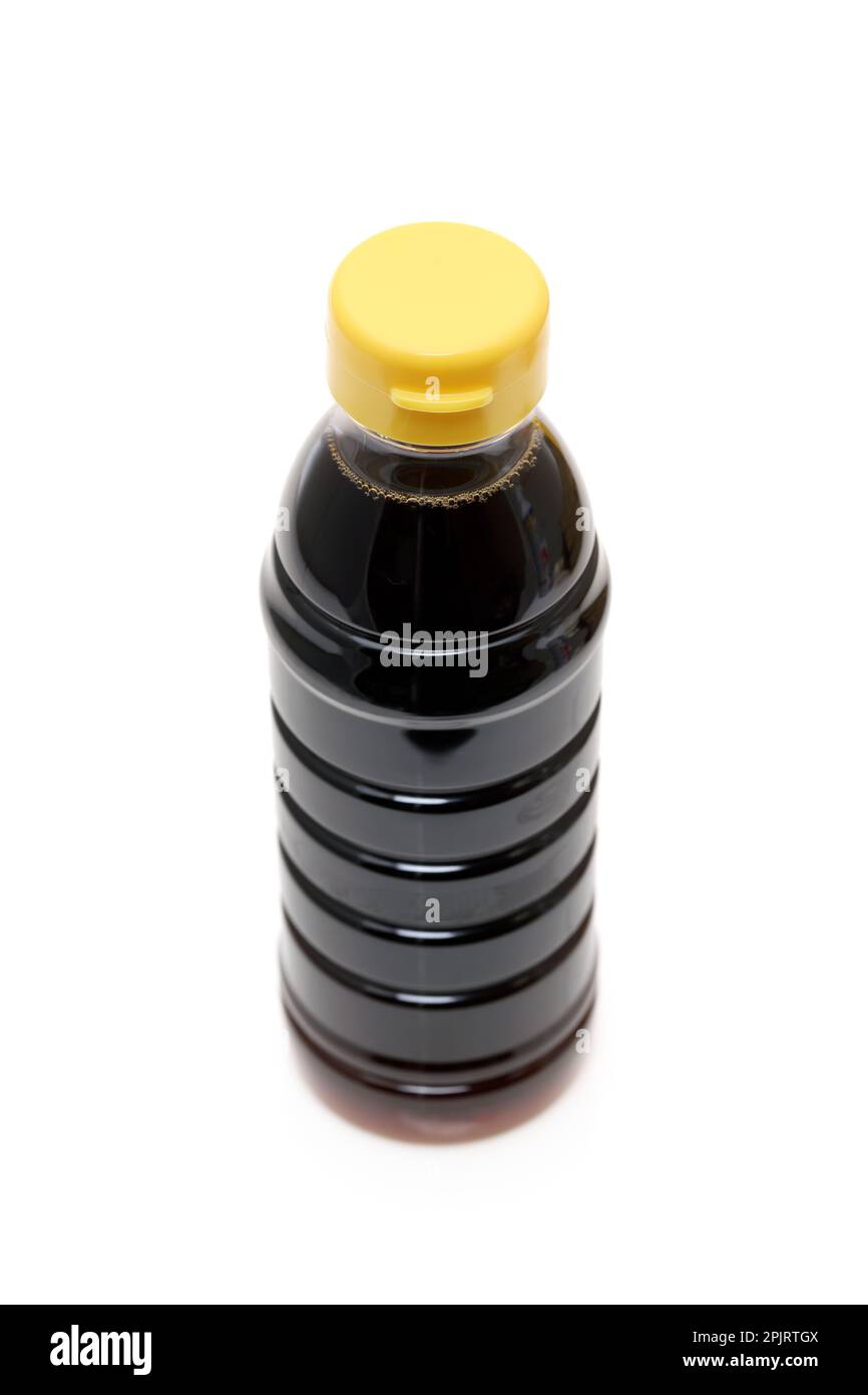 Plastic bottle of soy sauce on white background Stock Photo