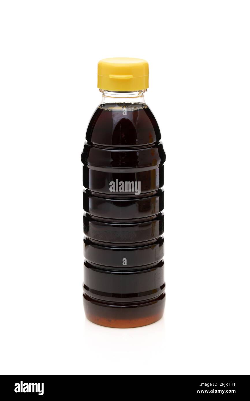 Plastic bottle of soy sauce on white background Stock Photo