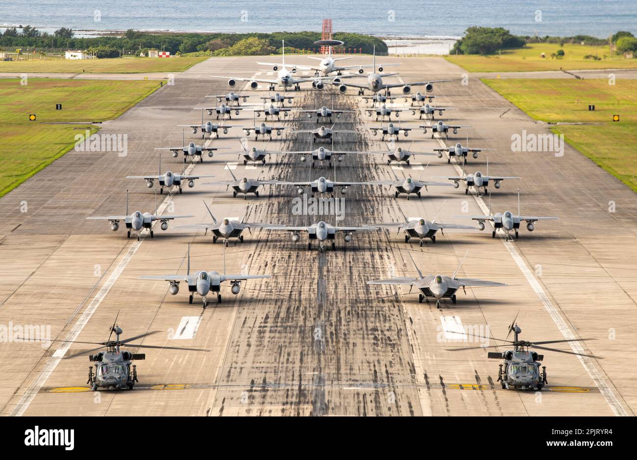 U.S. Air Force aircraft line up on the runway during a capabilities demonstration at Kadena Air Base, Japan, Nov. 22, 2022. Kadena’s ability to rapidly generate U.S. airpower is a vital function of its mission to ensure the stability and security of the Indo-Pacific region. (U.S. Air Force photo by Senior Airman Jessi Roth) Stock Photo