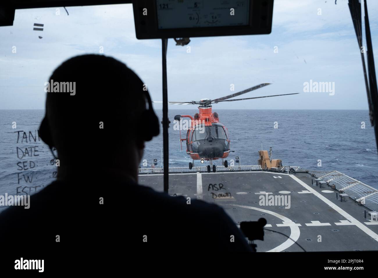 A crewmember aboard Coast Guard Cutter Midgett (WMSL 757) oversees