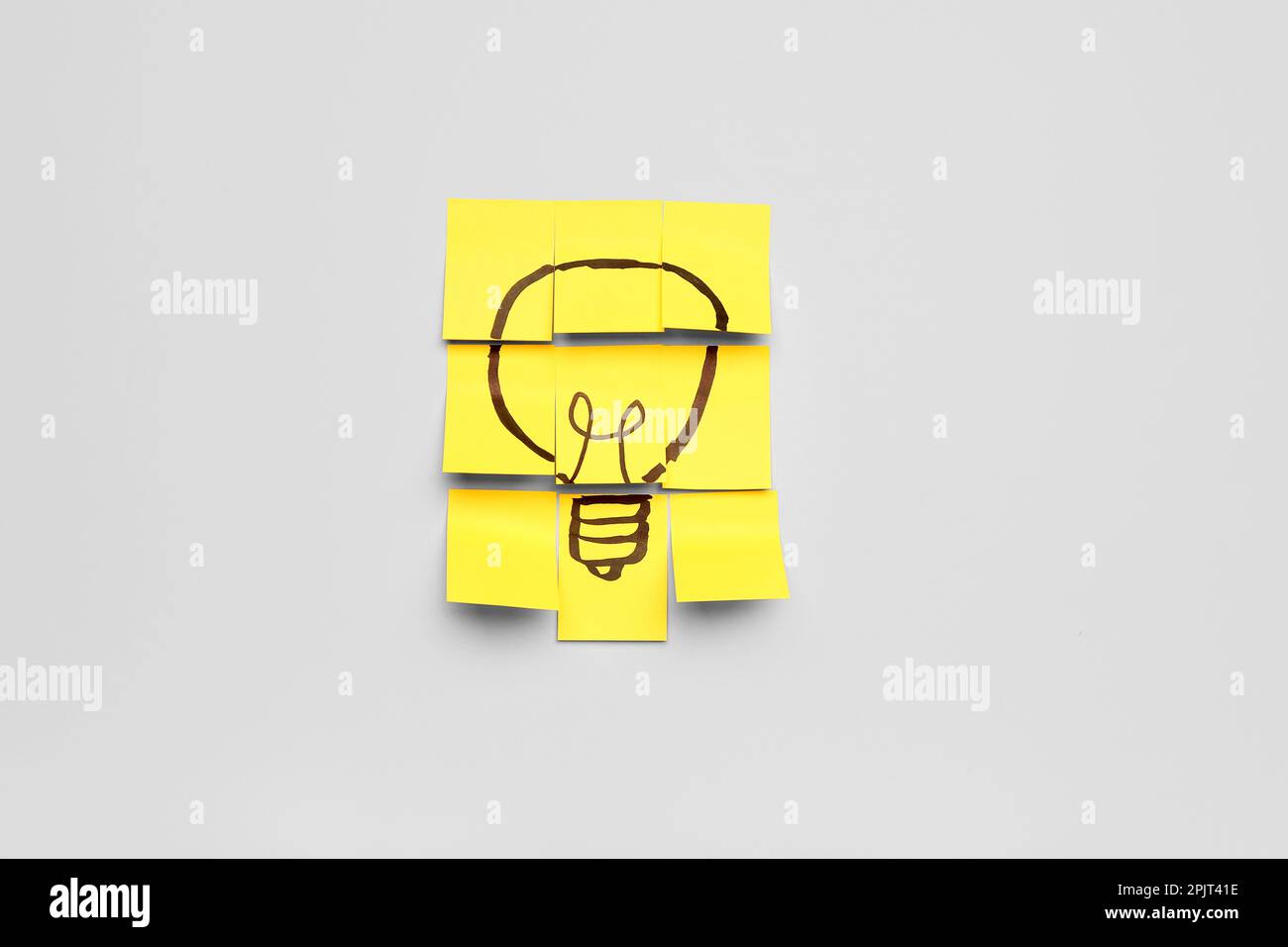 Sticky papers with drawn light bulb on light background. Insight ...