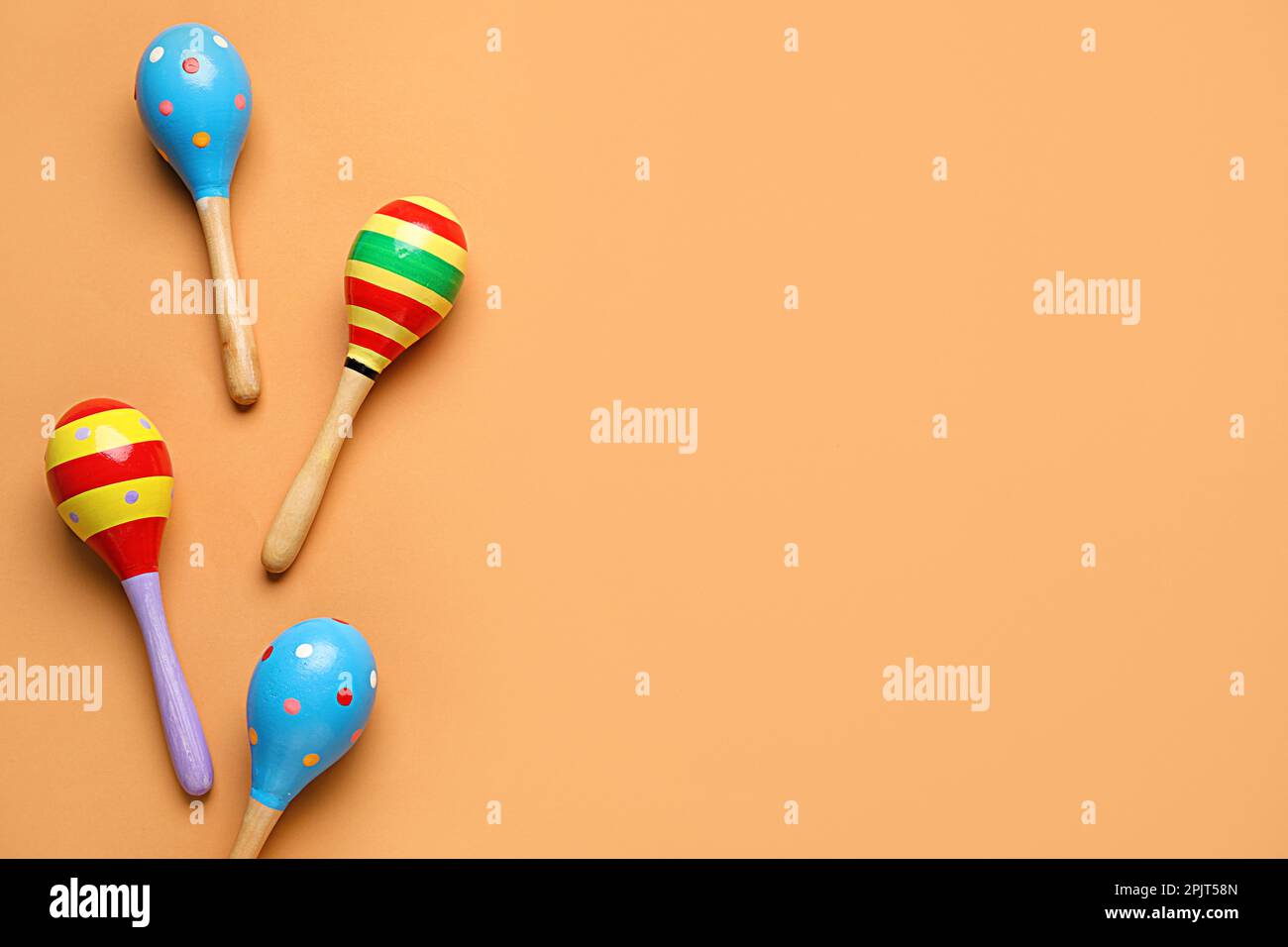 Mexican maracas on orange background Stock Photo - Alamy