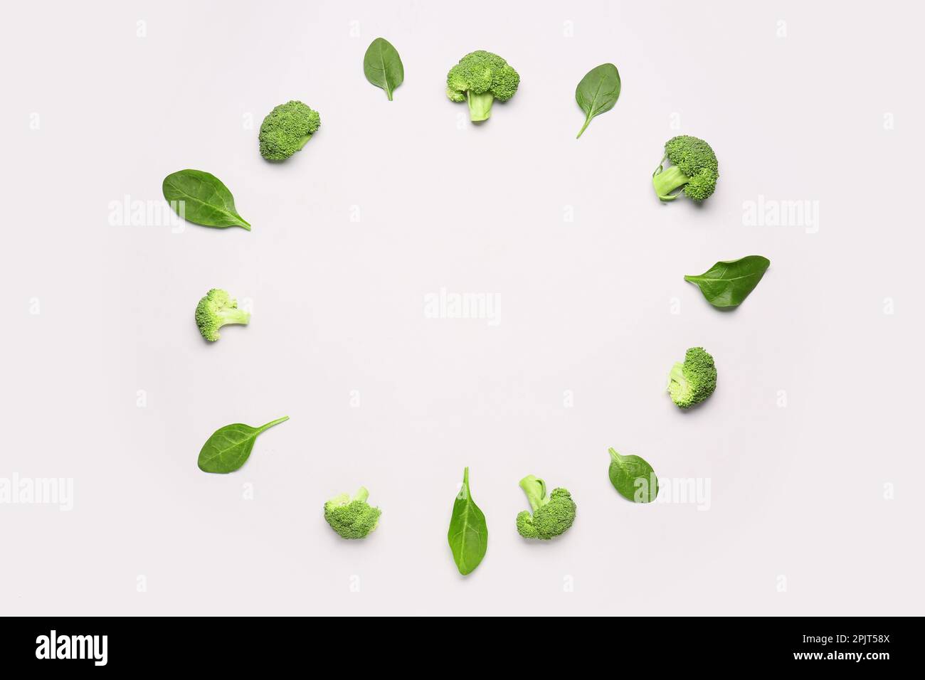 Frame made of broccoli and spinach on white background Stock Photo - Alamy