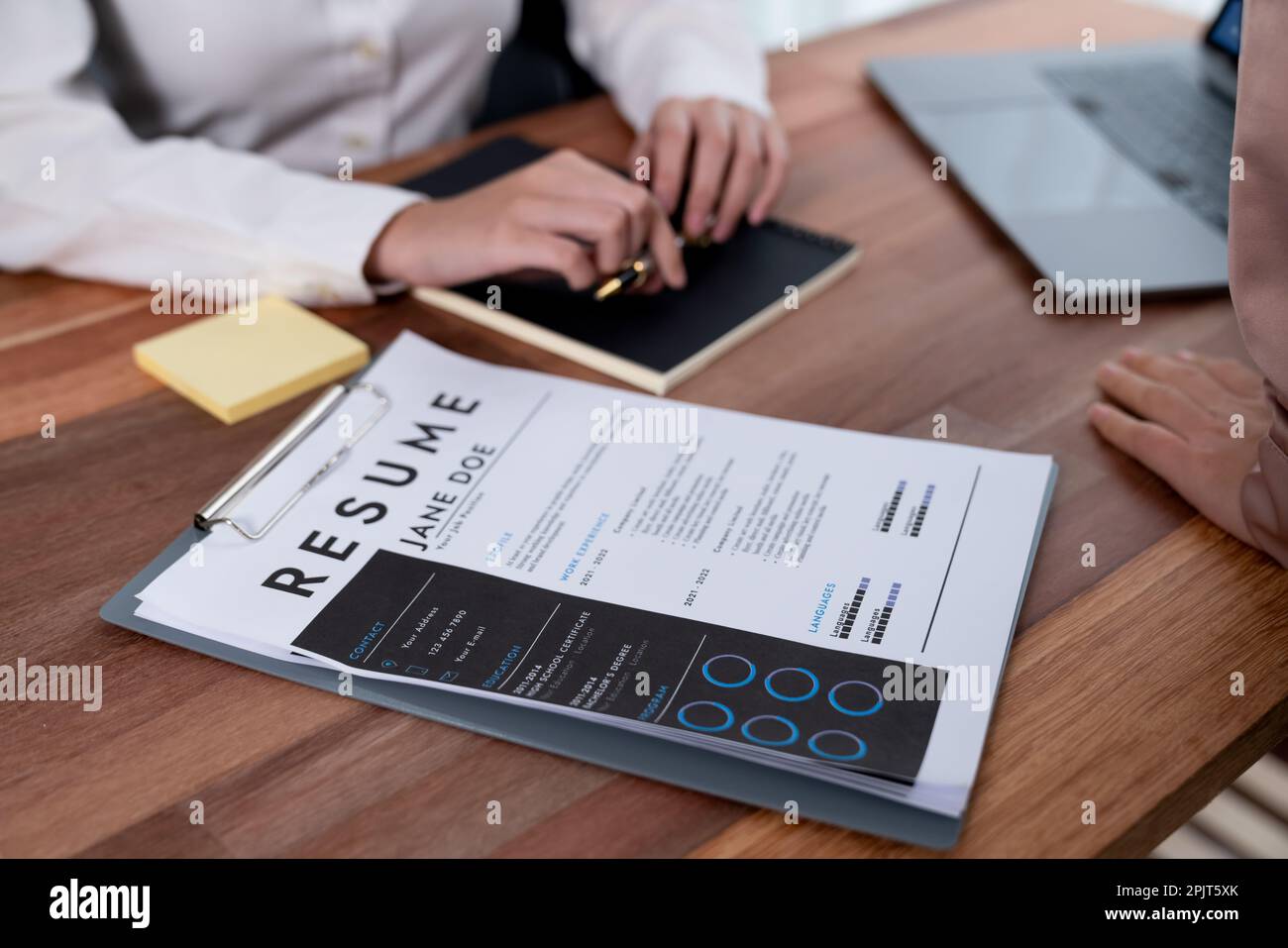 Closeup resume paper with qualifications on the desk during job