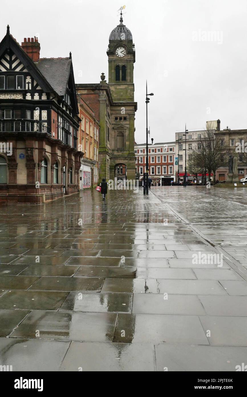 The Guildhall in the centre of Derby just after the rain showing its reflection on the wet pavement of the market place. Stock Photo