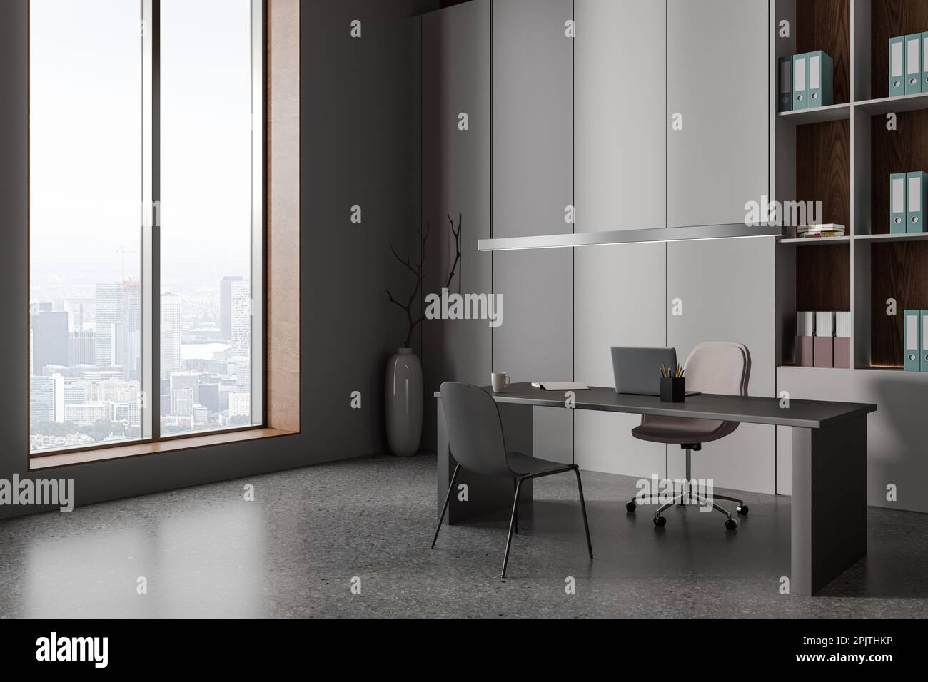 Dark modern business office interior with laptop computer on desk, side view grey concrete floor. CEO corner with shelf, armchair and panoramic window Stock Photo