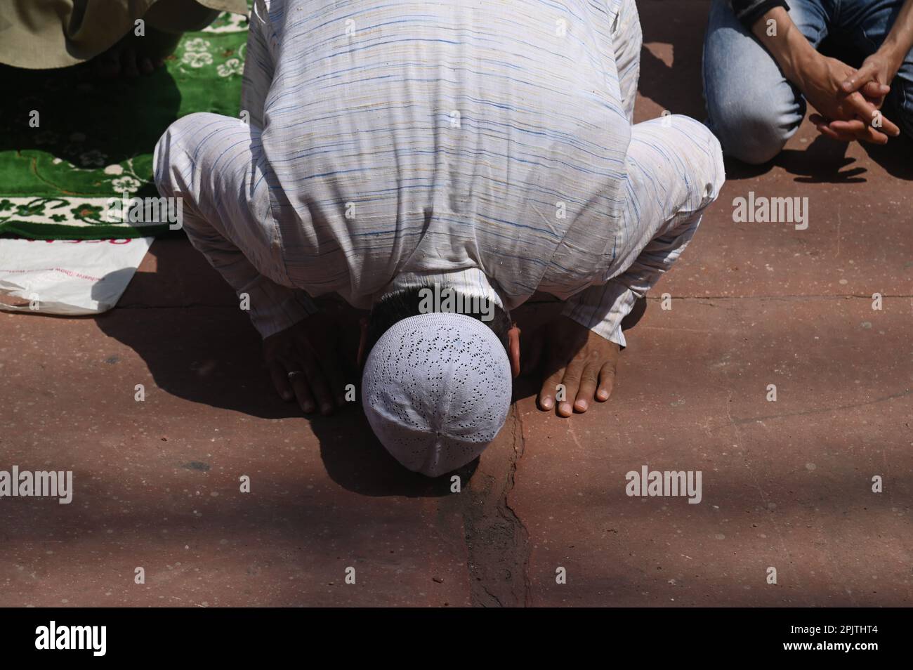 Muslim devotees offer Friday Prayers during the holy fasting month of Ramadan in Jamia Masjid , in the old quarters of New Delhi on March 31 , 2023 . Stock Photo