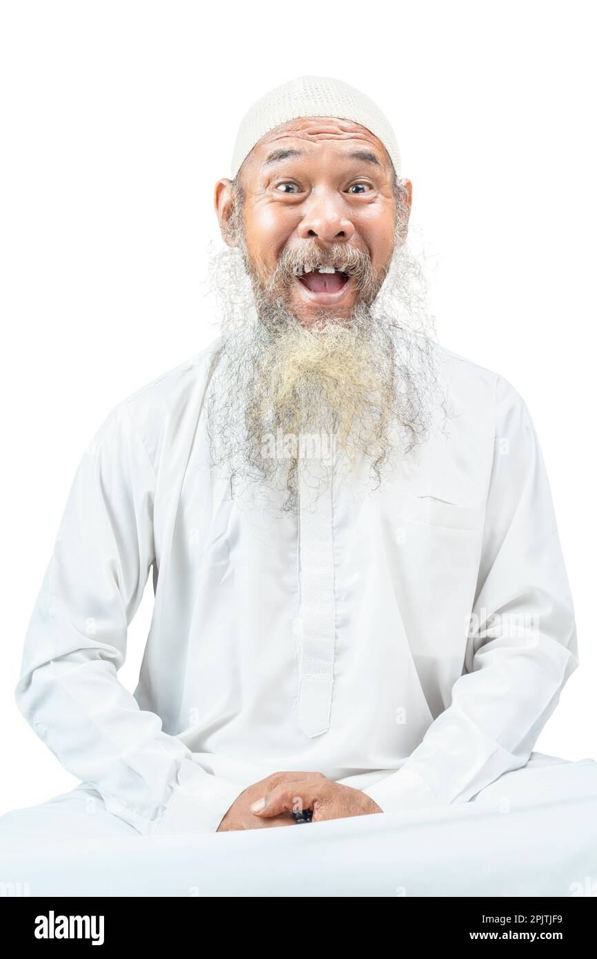 Muslim man with a beard wearing a white cap isolated over white