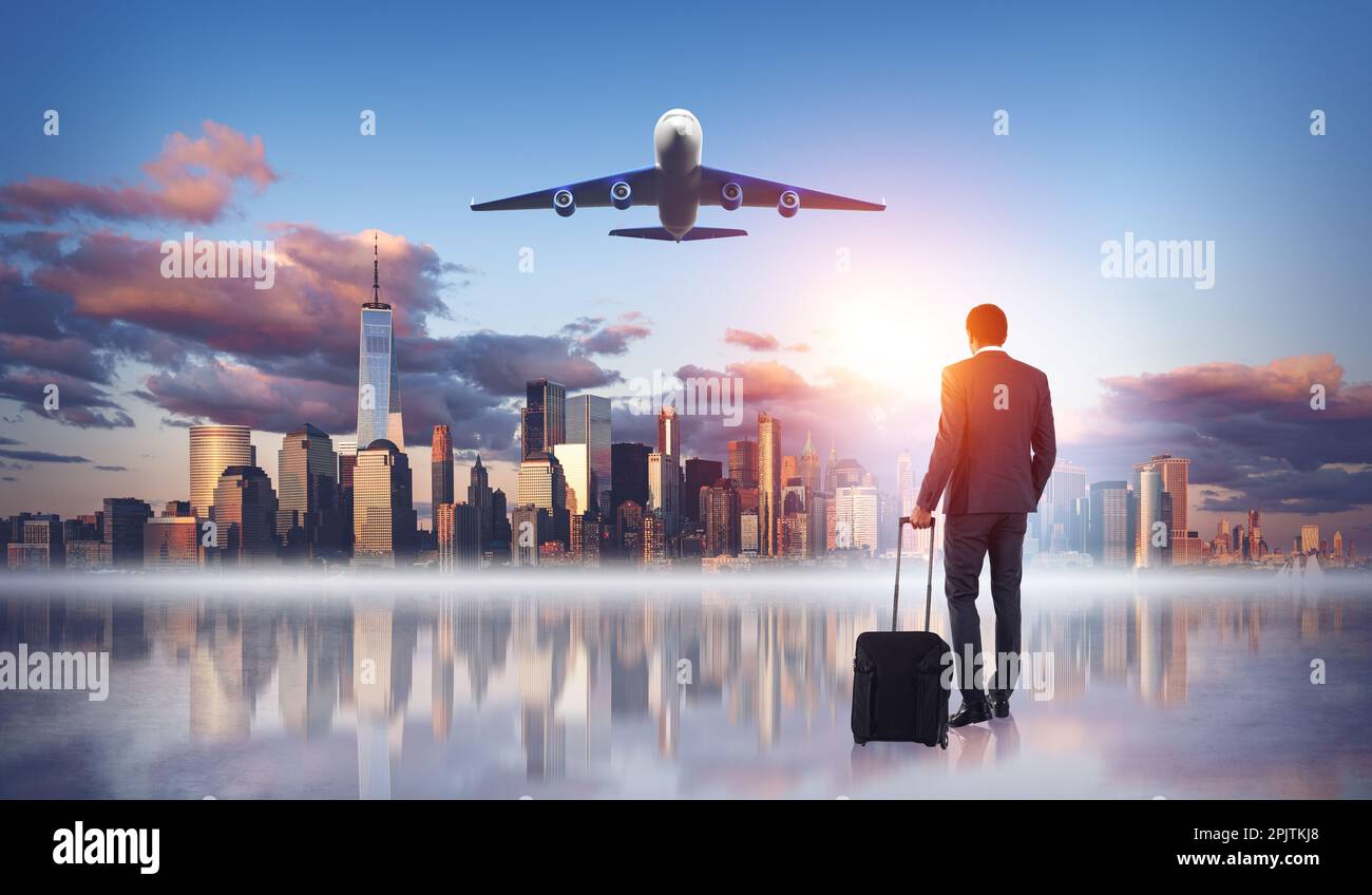 New York skyline and flying airplane, businessman walking with suitcase