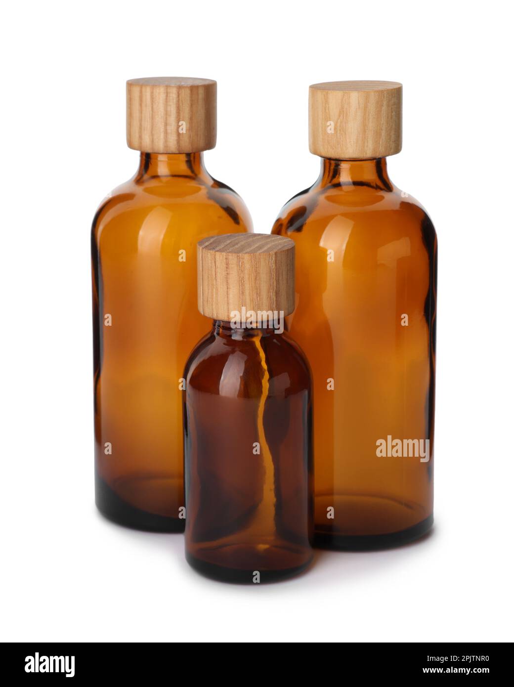 New empty glass bottles with wooden caps isolated on white Stock Photo