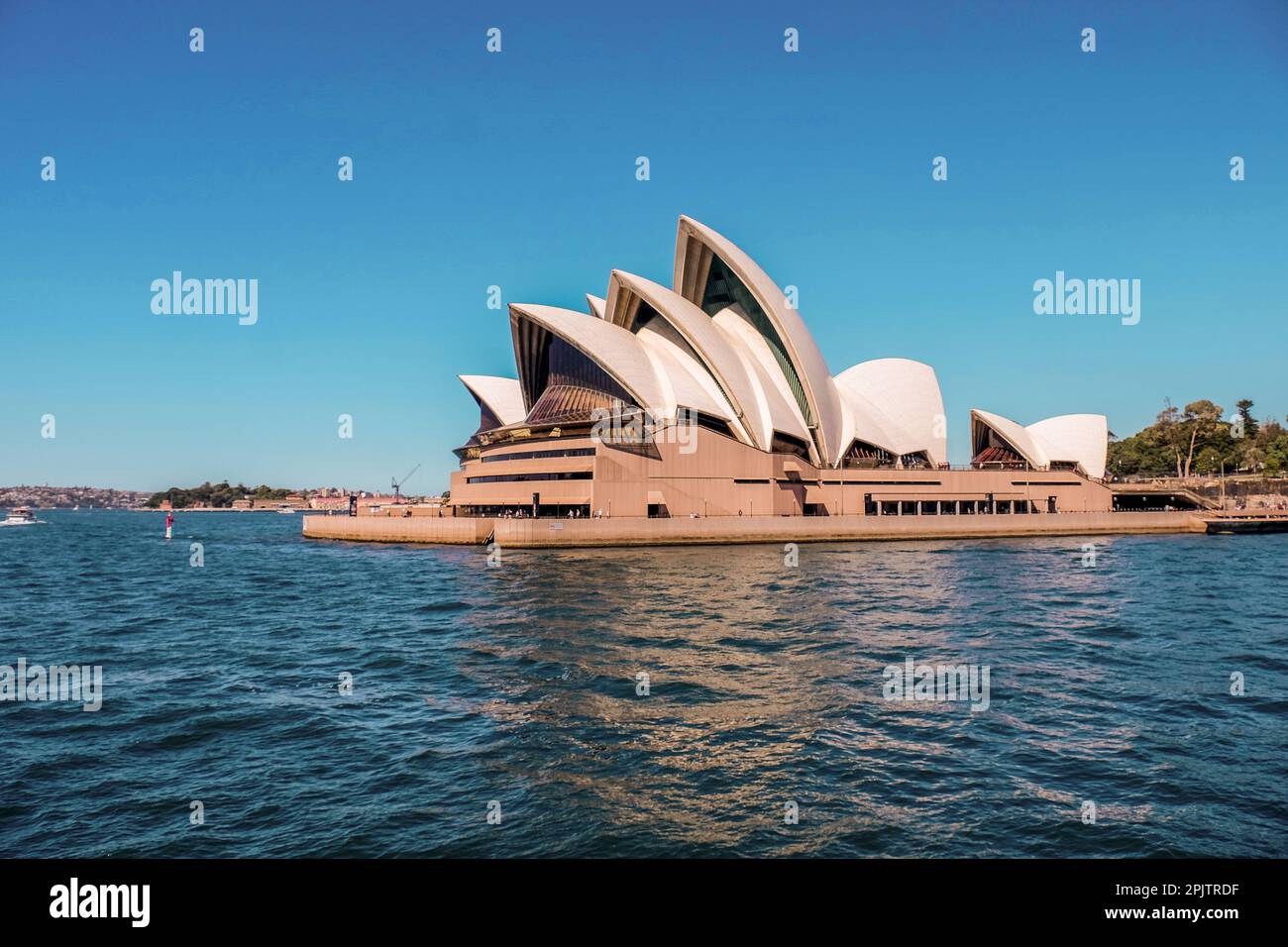 View of the iconic Sydney Opera House in the daytime from the Manly Ferry. Stock Photo