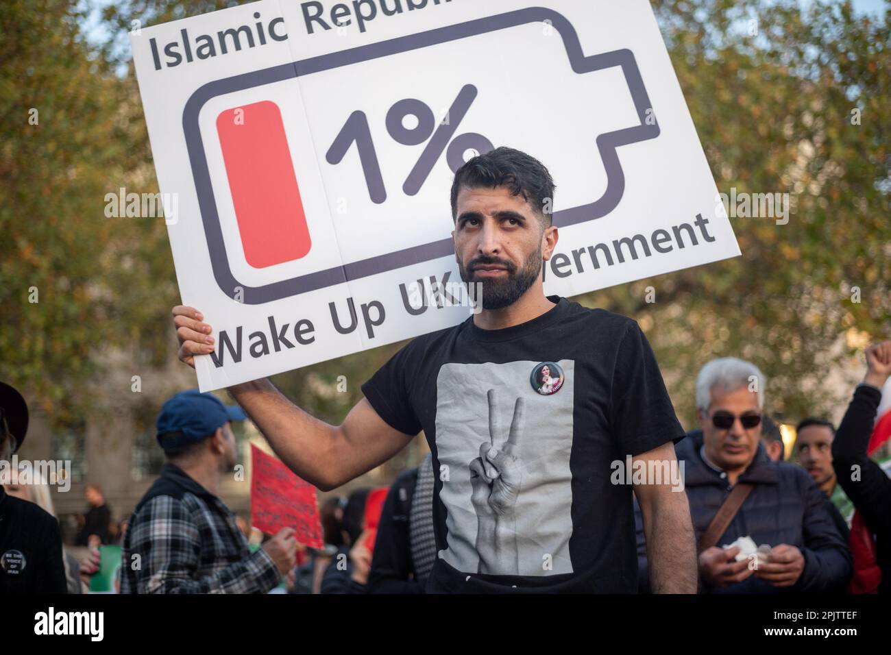 British-Iranian activist protesting against the Islamic Republic regime in Iran. Gathered outside Downing Street, demanding the closure of the Iranian Embassy in London. Stock Photo
