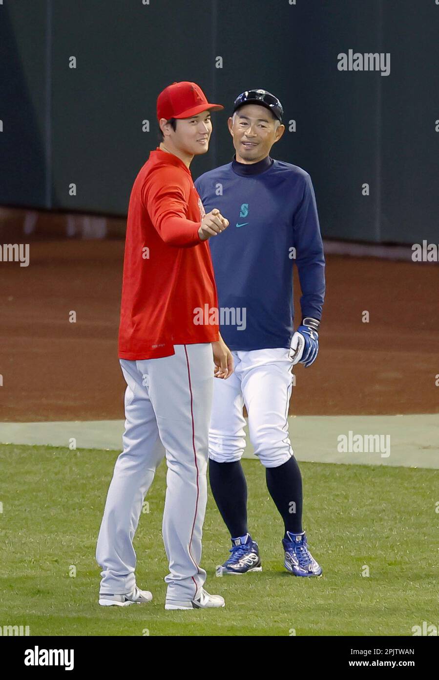 Los Angeles Angels two-way player Shohei Ohtani (L) and former Seattle  Mariners outfielder Ichiro Suzuki are pictured before a game between the  two teams on July 10, 2021, at T-Mobile Park in