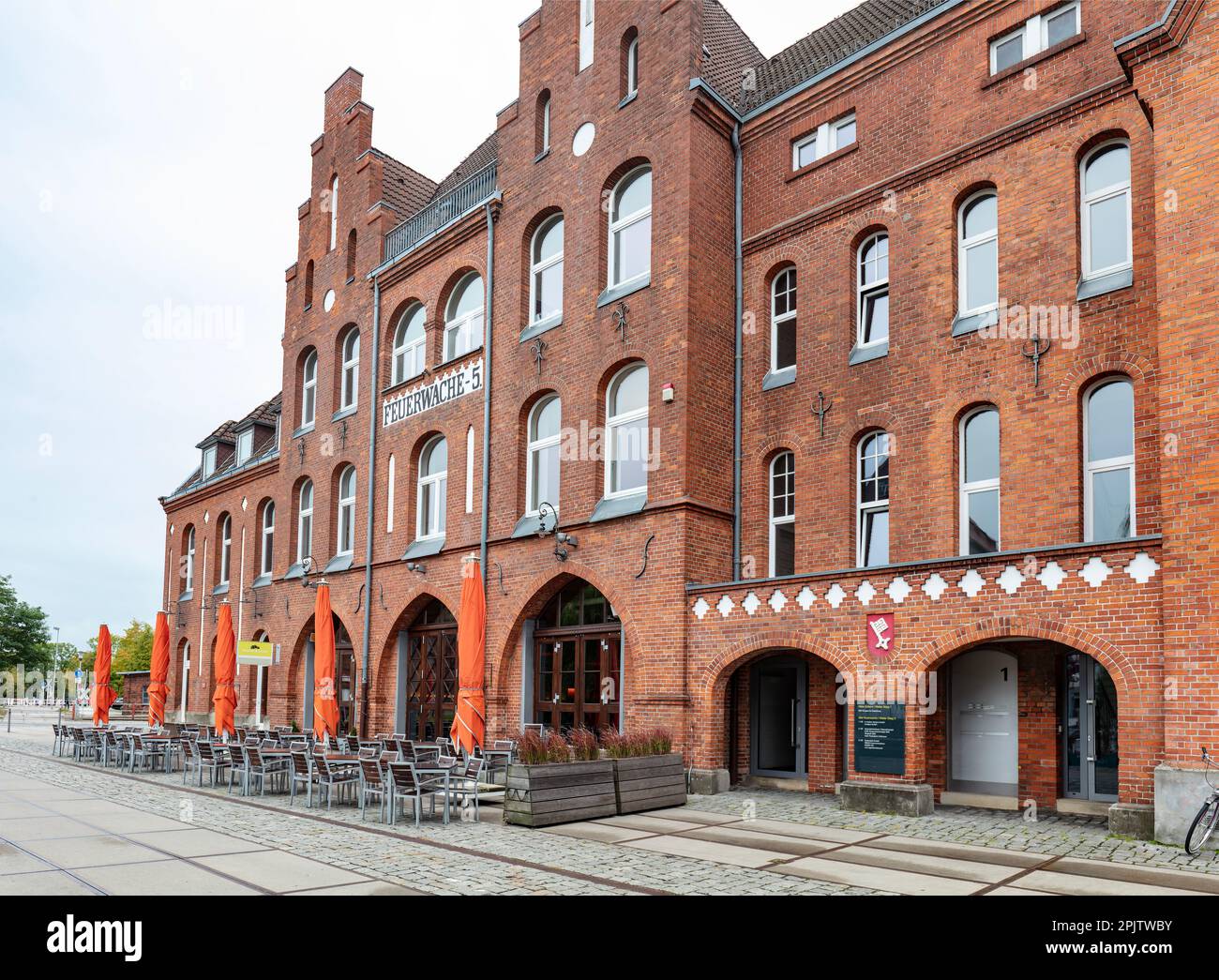 Former fire station now a restaurant - Feuerwache Gastronomiebetriebsges - in historic industrial area in Waller Stieg, Walle district, Bremen. Stock Photo