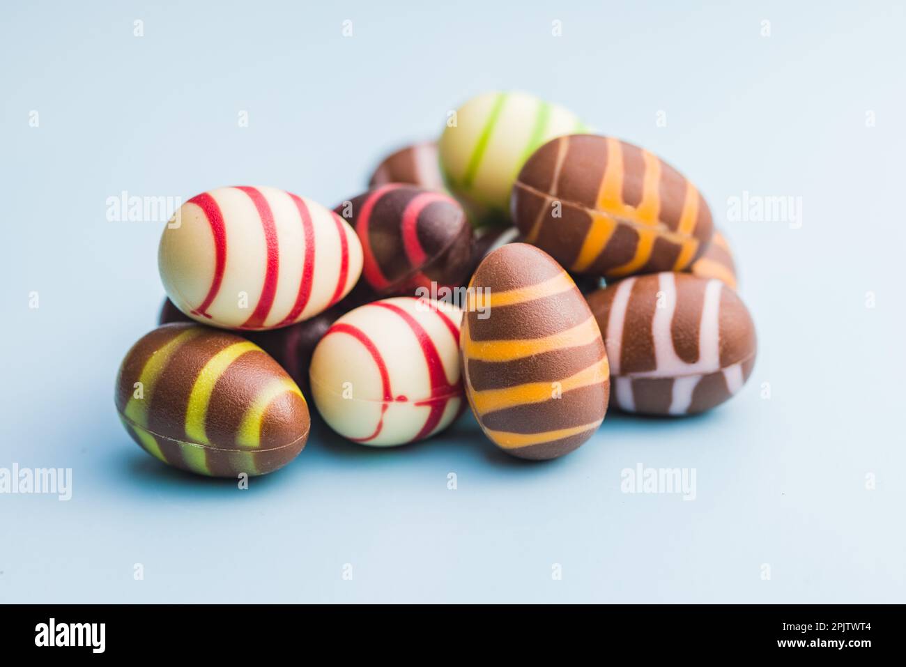 Chocolate easter eggs on the blue background. Stock Photo