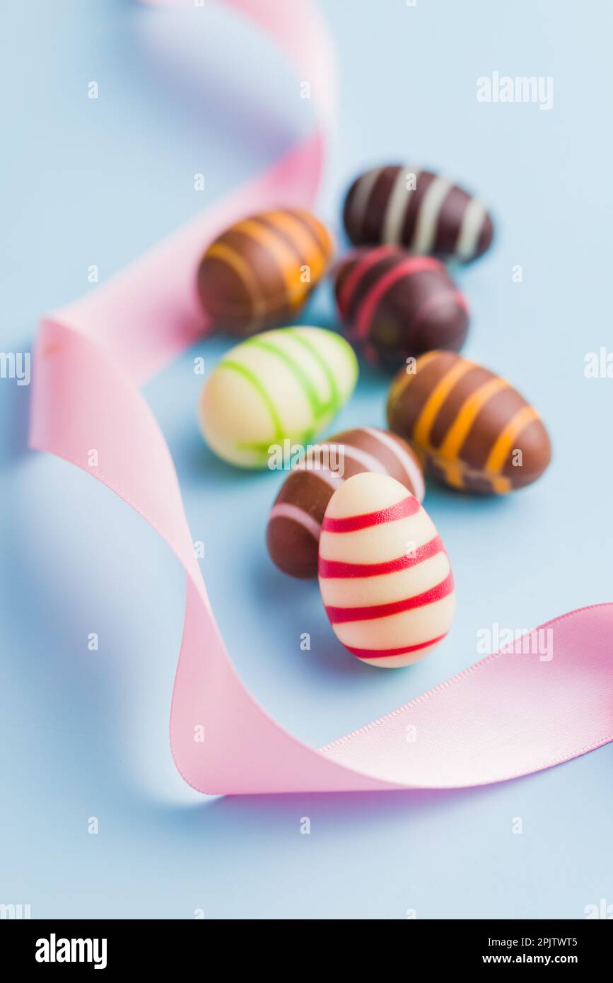 Chocolate easter eggs on the blue background. Stock Photo