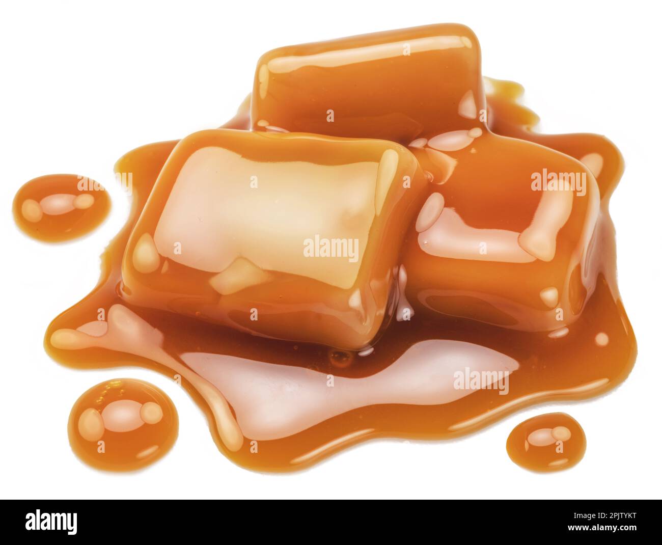 Caramel candies in milk caramel sauce isolated on white background