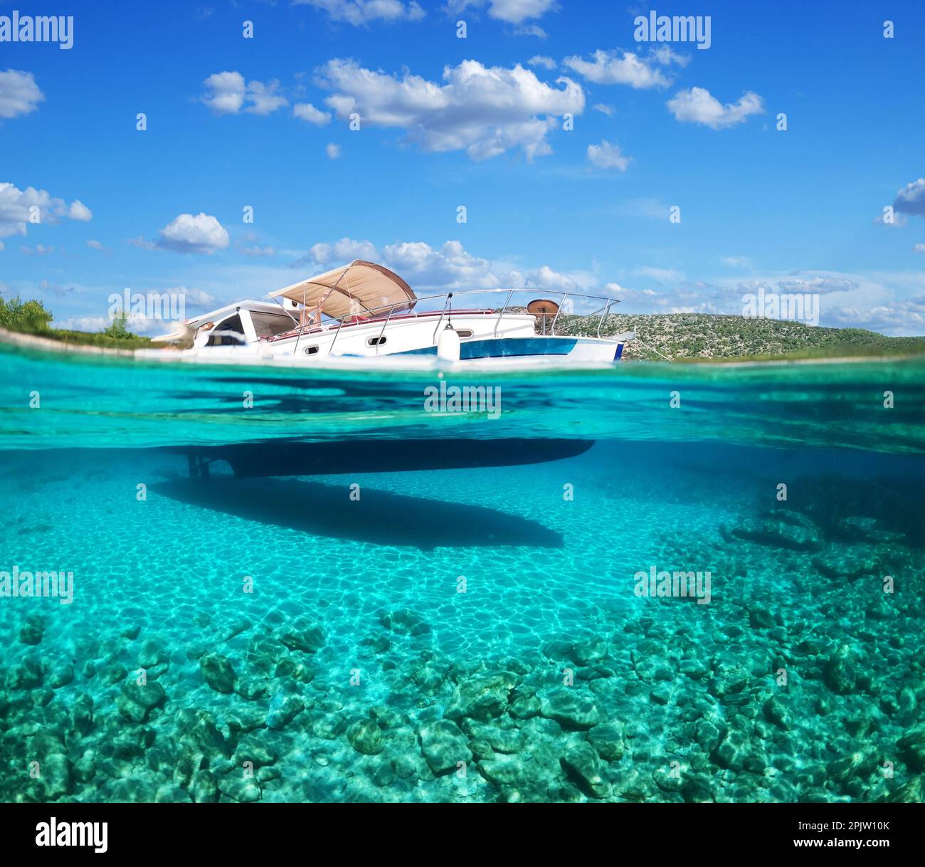 Split view half underwater view of beautiful seabed with sea fishes
