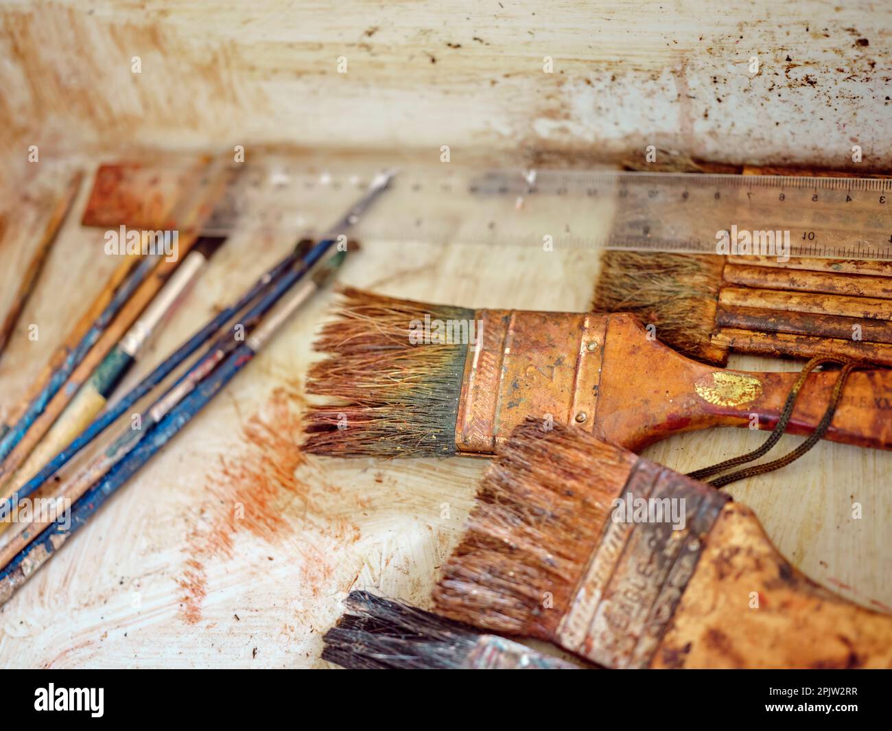 Row of artist paintbrushes closeup on artistic  background . paints and accessories for drawing Stock Photo