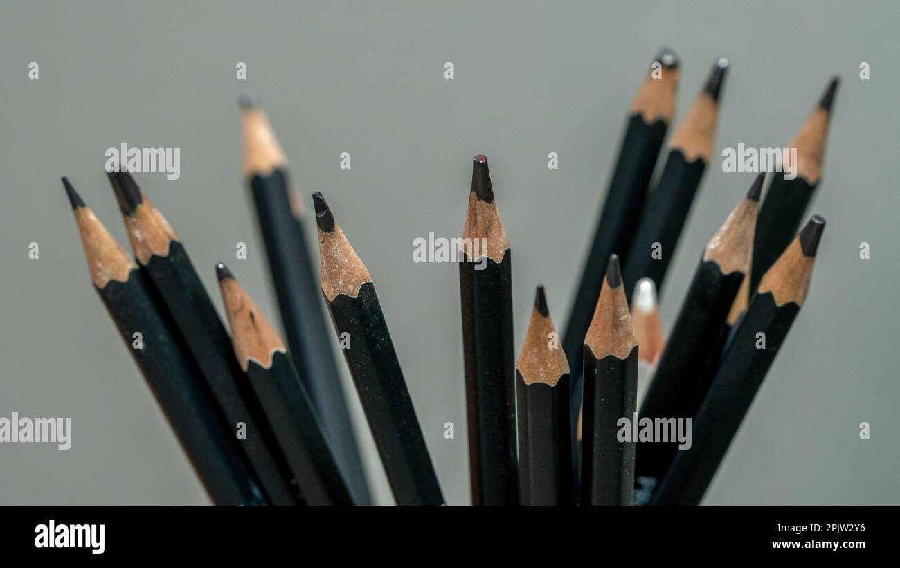 Pencils on a gray background close-up macro photography. Stock Photo