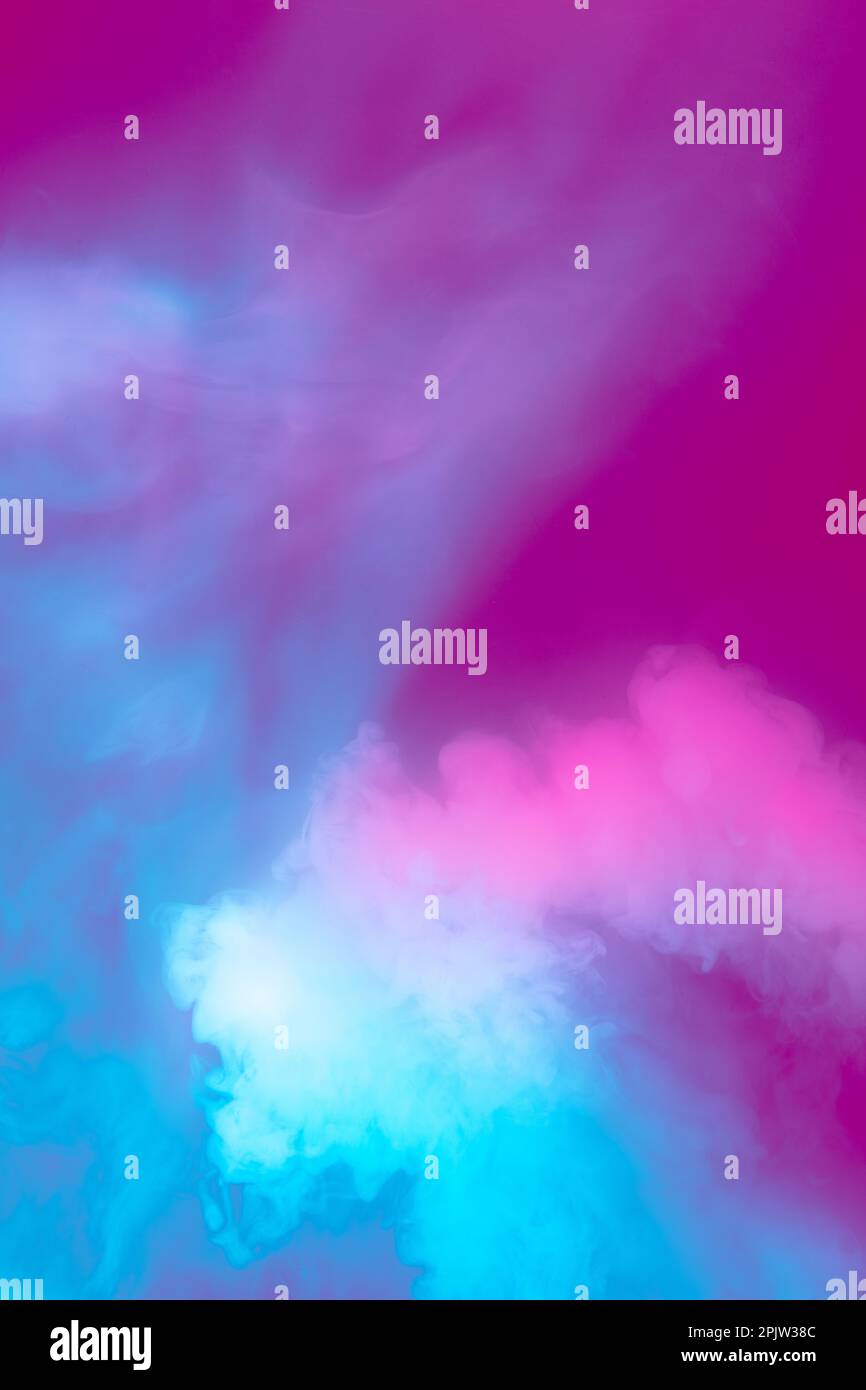 Blue and pink. Abstract multicolored smoke spreading in neon light