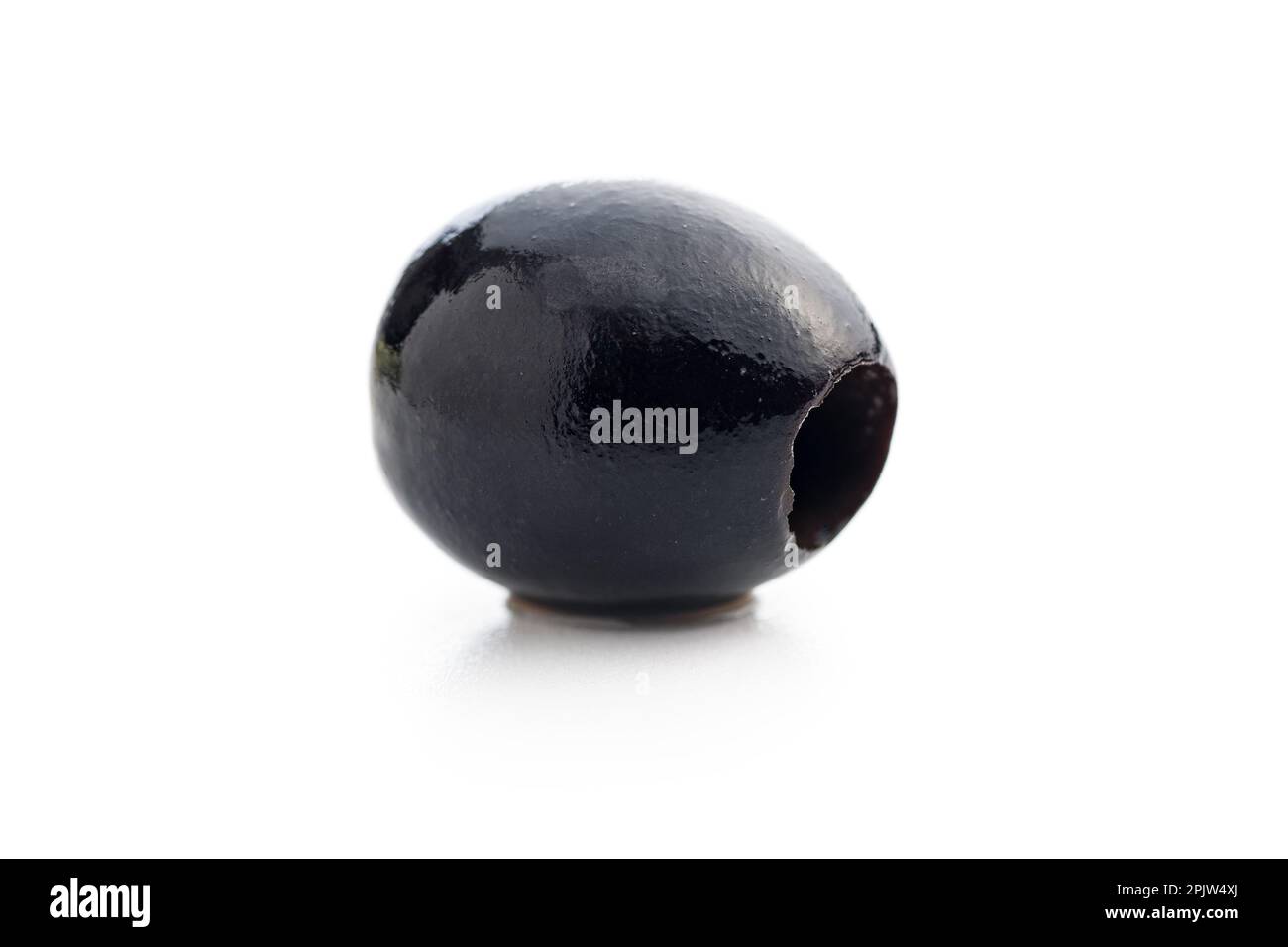 Pitted black olive isolated on the white background. Stock Photo