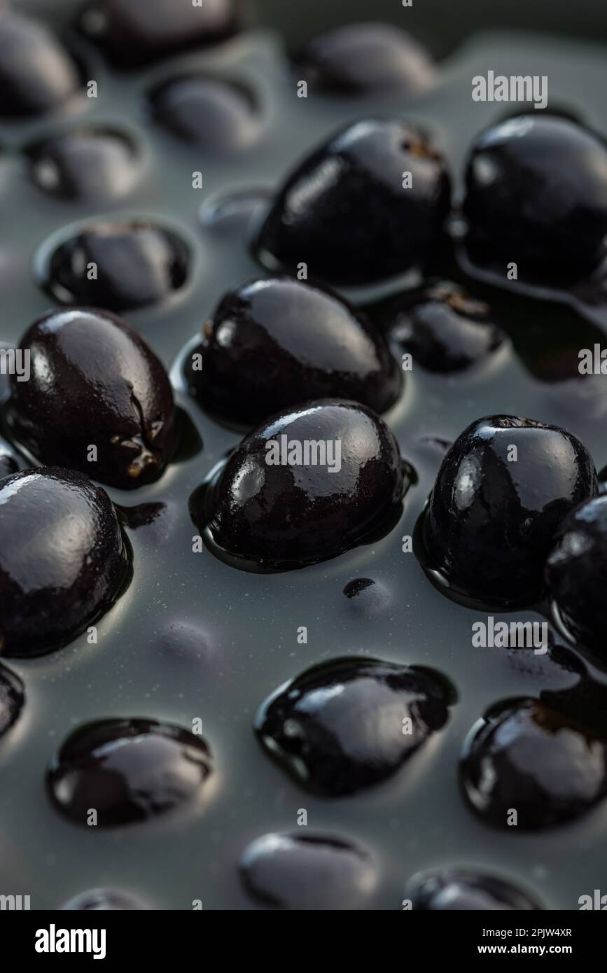 Pitted black olives. Marinated olives in pickle Stock Photo Alamy