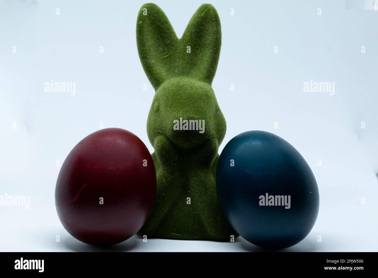 Easter bunny and red - blue easter eggs Stock Photo