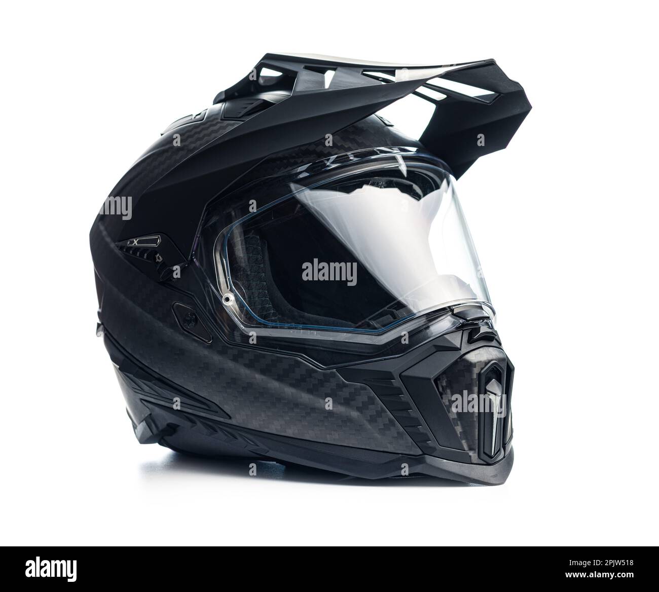 Black carbon motorcycle helmet. Offroad motocross helmet with shield isolated on white